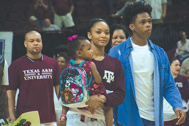 Curtyce Knox and her daughter Haven Short wait for her name to be called in senior recognition.