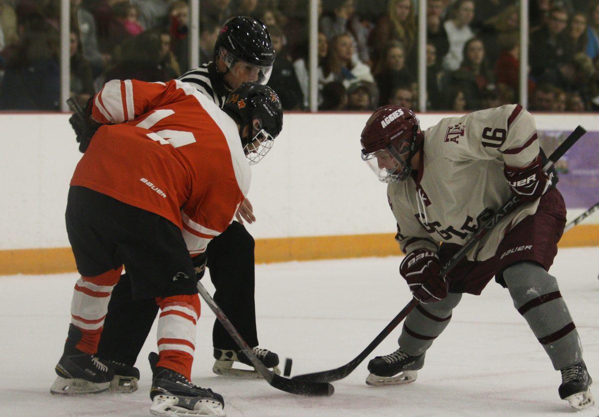 Foward Spencer Delman faces off against O'Reilly.