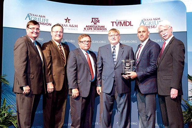 (Left to right) Mark Hussey, Van Taylor, Otway Denny, M. Edward Rister, one of the recipients of the Partner on PhilanthropyFaculty Award, Tyson Voelkel and Jorge Berm&#250;dez present the award to the recipients.