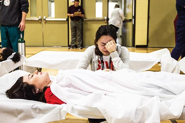 Disaster Day includes hundreds of volunteers pretending to be victims of a disaster so students can practice responding in an emergency capacity.