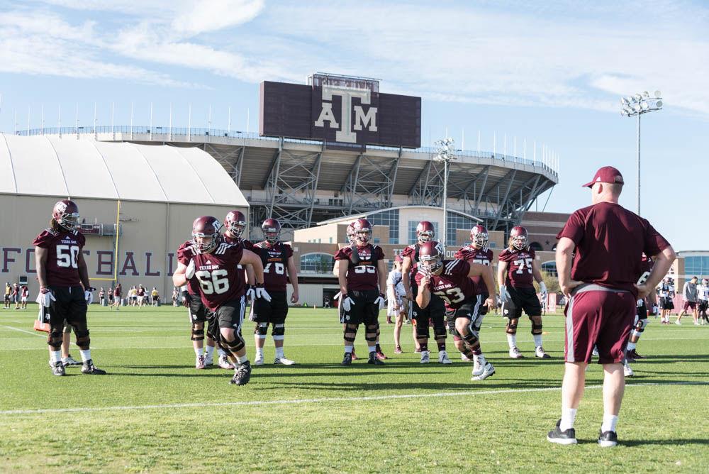 Offensive line coach Jim Turner leads his unit in individual drills during the firstday of spring practice for the football team.