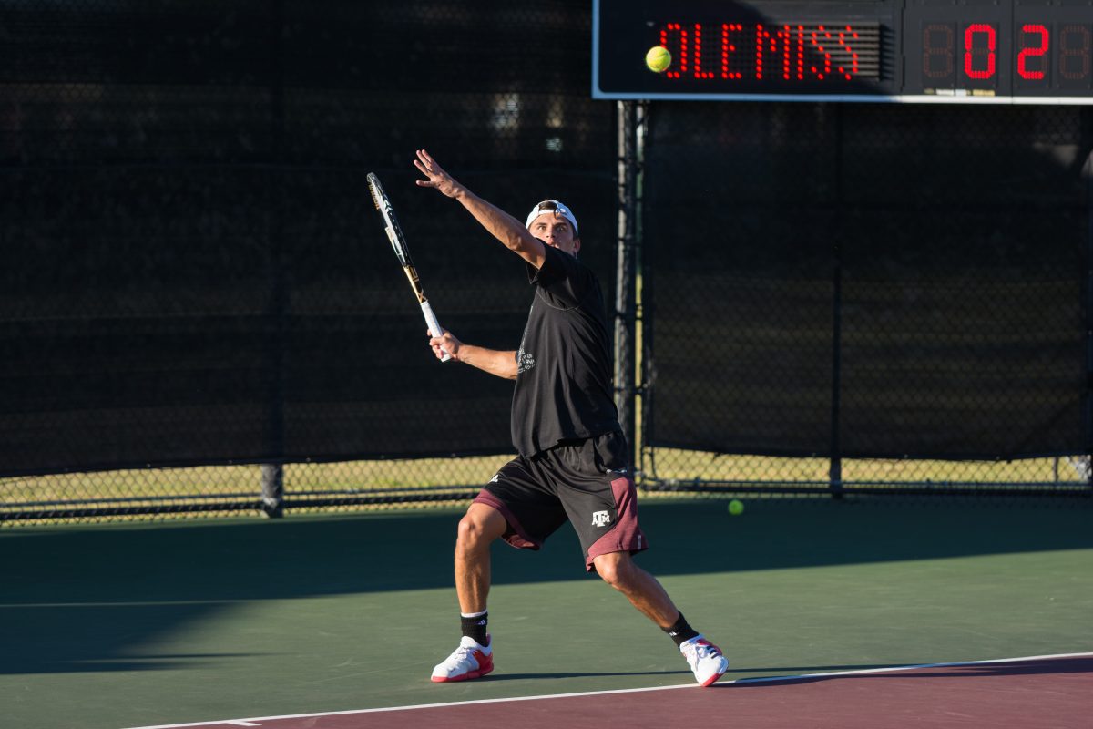 Junior Jordi Arcanada winds up to hit the ball.&#160;