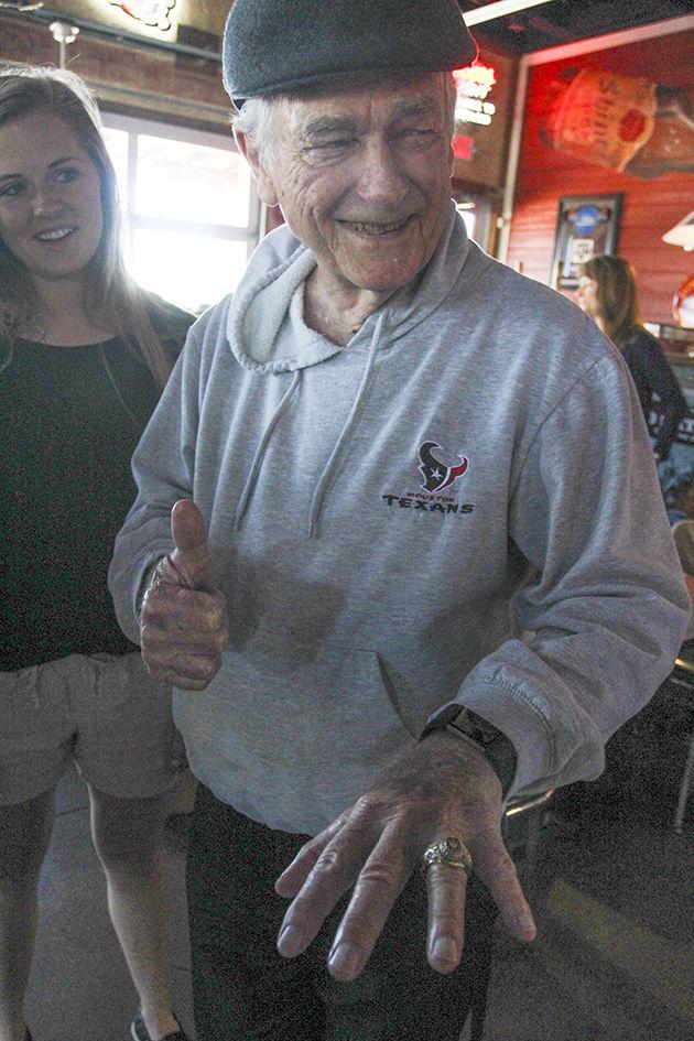 A&M professor Arnold LeUnes was surprised by students with an Aggie Ring Sunday to replace the one he lost to a house fire.