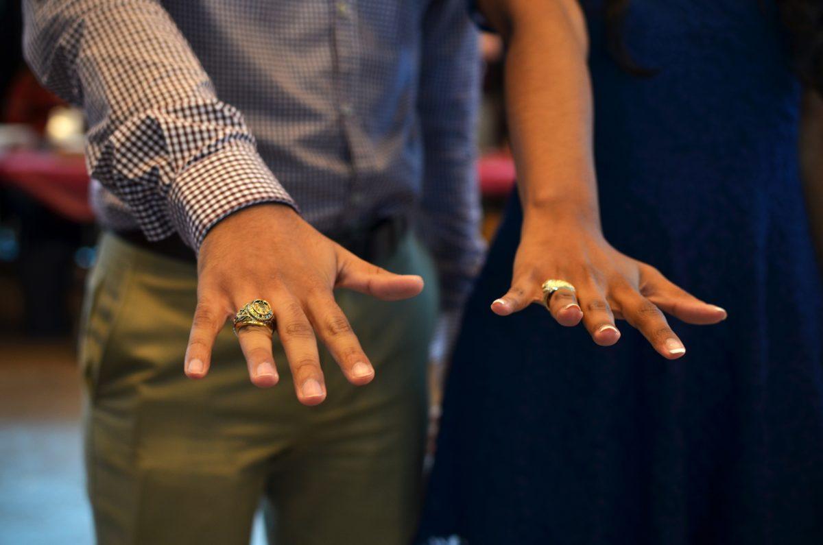 <p>Two students brandish their new Aggie rings during the Fall semester ring day on November 4th, 2016.</p>