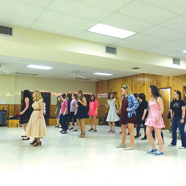 During the Swing Cat’s semersterly dance, Swing Cat members teach attendees East Coast Swing.