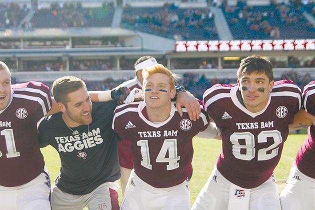 Quarterbacks Conner McQueen (right) and Trevor Knight sing the War Hymn after defeating UTSA in November.