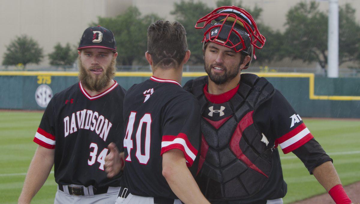 <p>Davidson student manager <strong>James Padley</strong> hugs catcher <strong>Jake Sidwell</strong> before first pitch.</p>