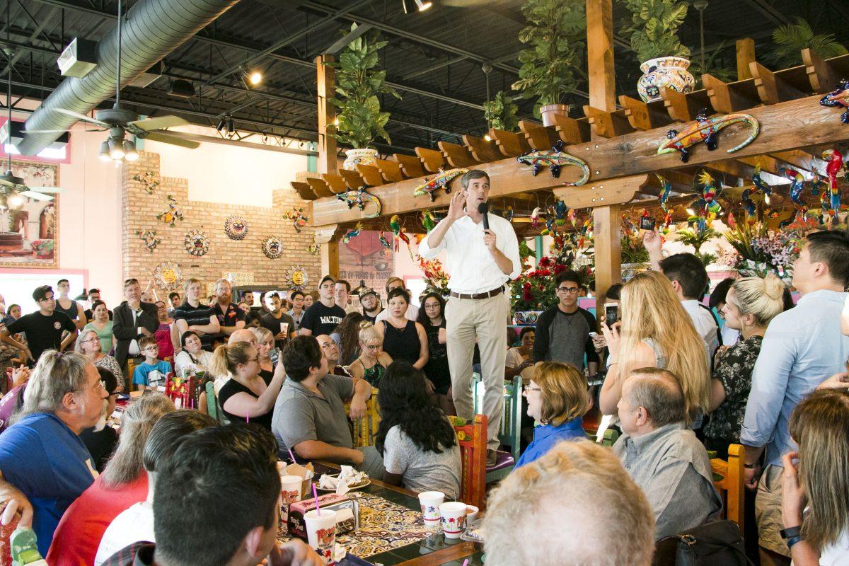 Democratic U.S. Congressman Beto ORourke stands on a chair to speak to over 200 people at Rosas Cafe in College Station, Texas. 