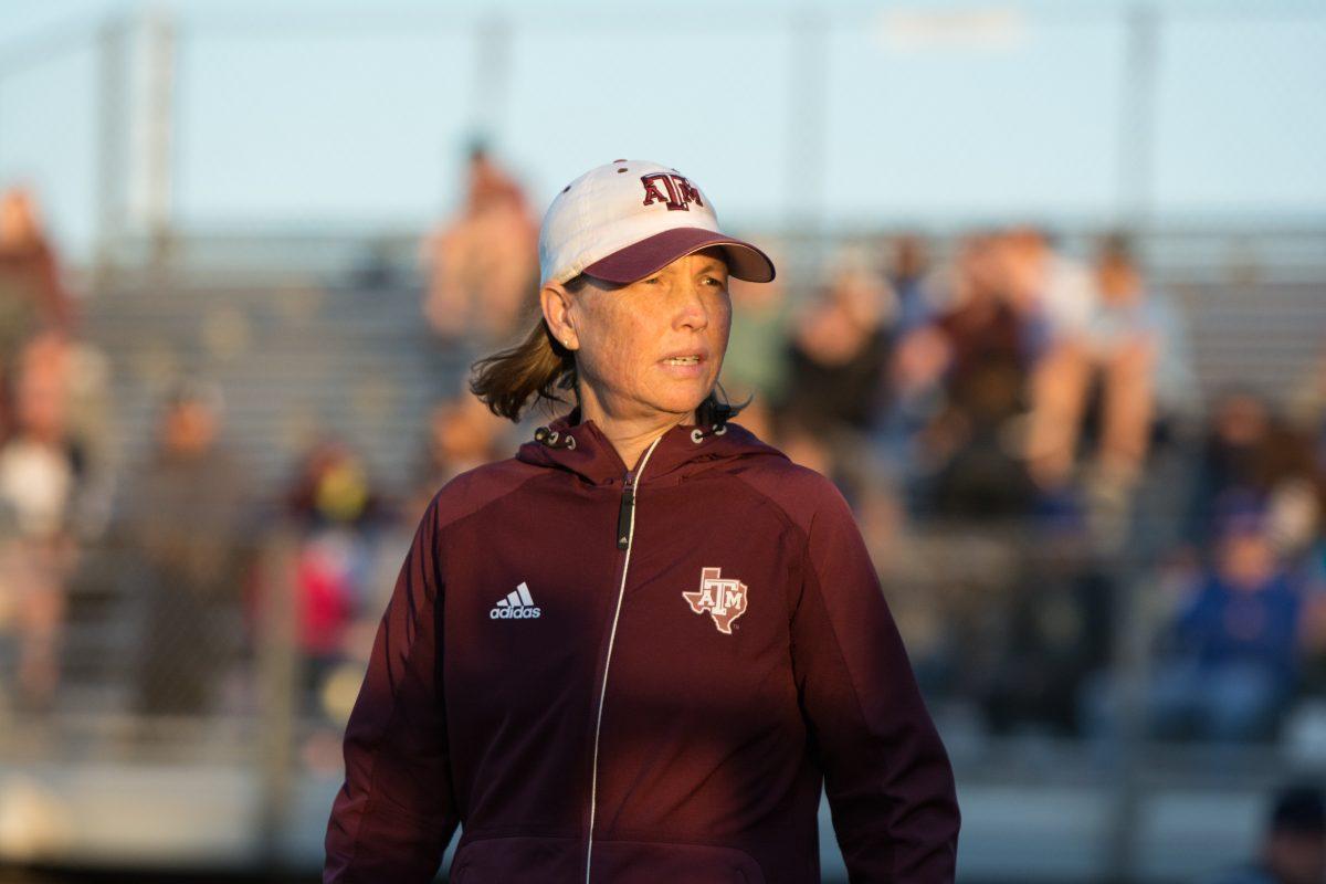 Head Coach&#160;Jo Evans&#160;examines her dugout to making adjustments in pitching.&#160;