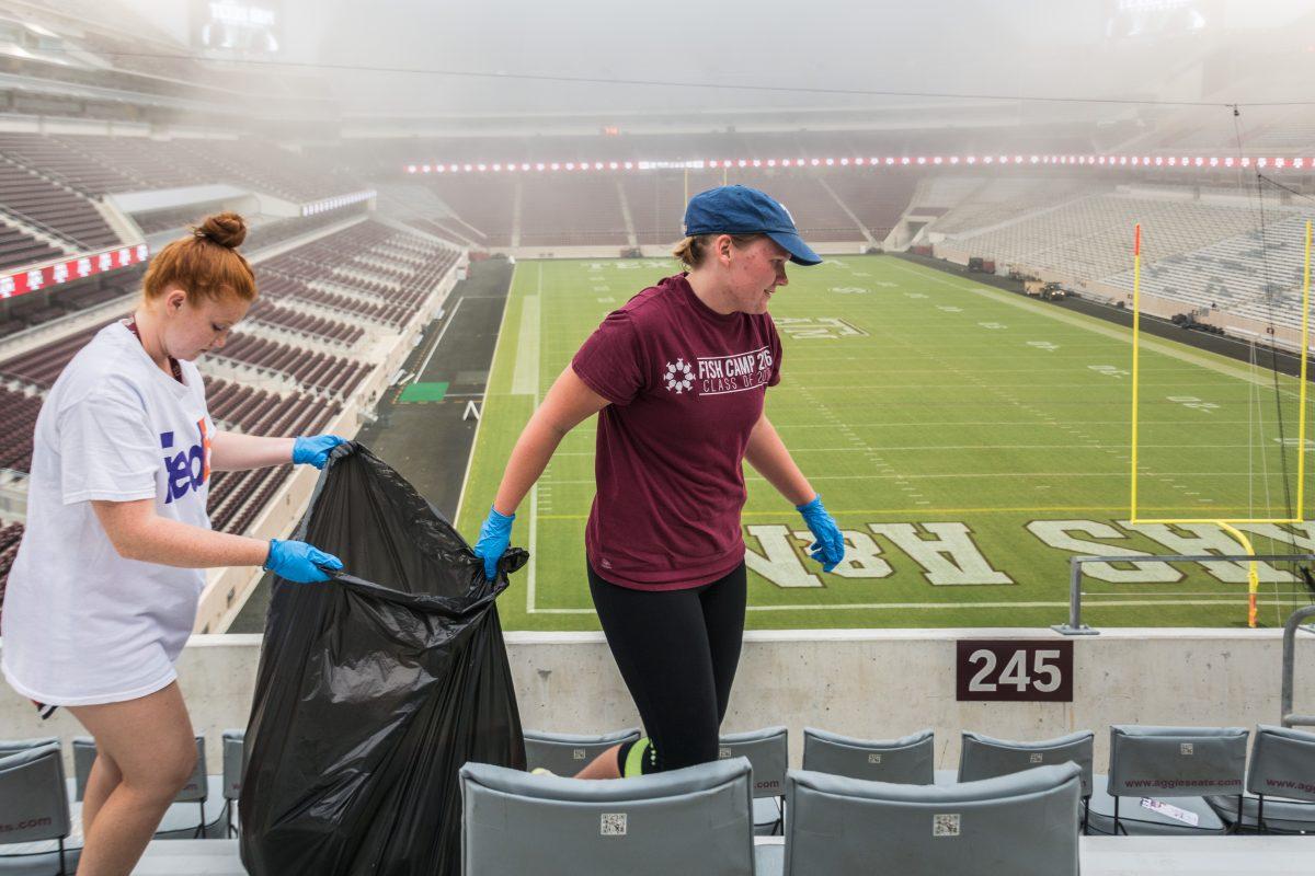 Freshman+kinesiology+major+Hannah+Kapfer+and+sophomore+computer+science+major+Samantha+Hay+spent+their+Sunday+morning+cleaning+up+trash+inside+of+Kyle+Field.