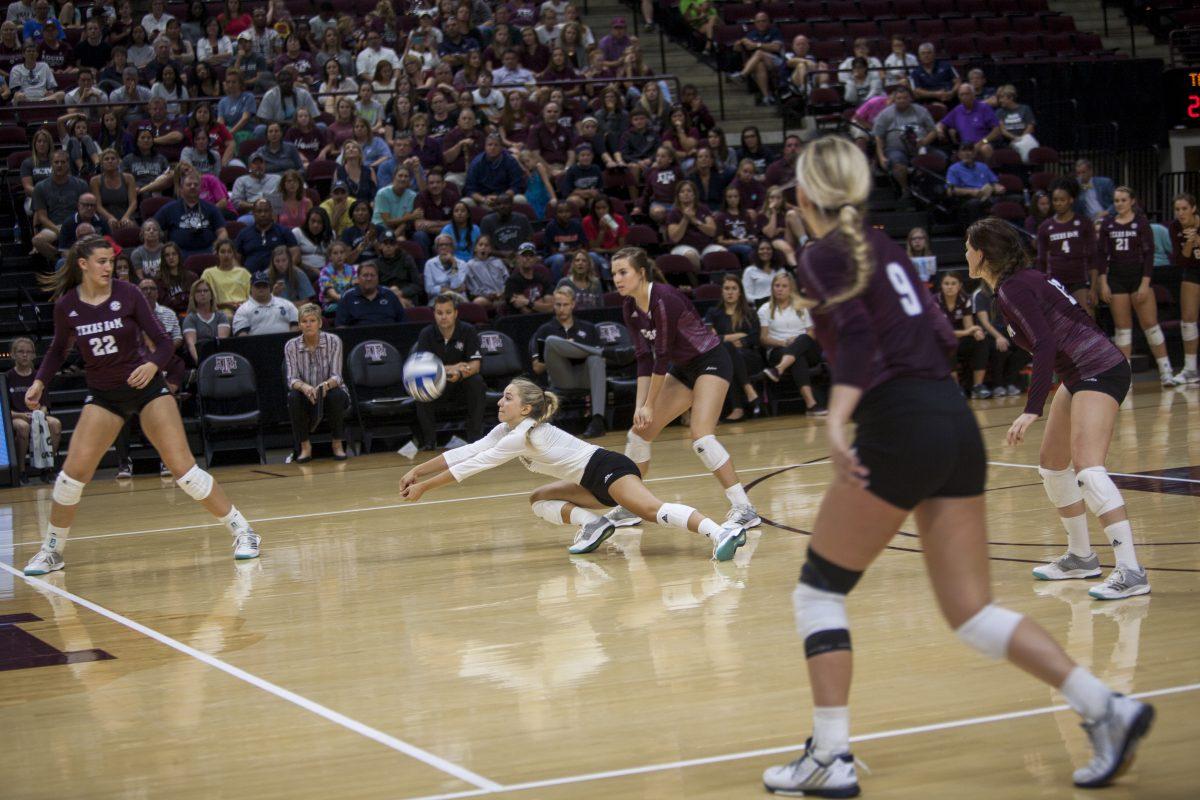 Senior+libero+Amy+Nettles+lunges+in+order+pass+the+ball+and+keep+the+Aggies+alive+in+the+fourth+set+of+the+game.
