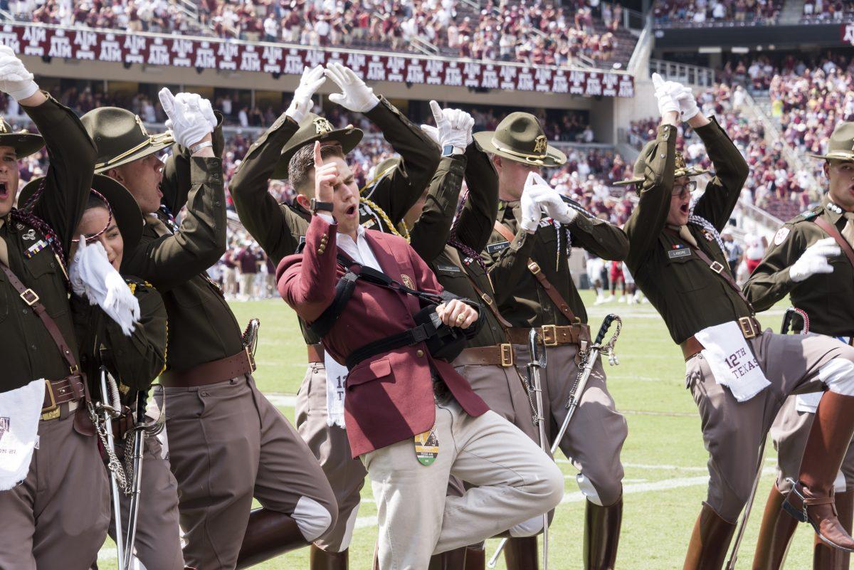 Construction+science+senior+and+Yell+Leader+Cooper+Cox+yells+from+the+sidelines+with+other+members+of+the+Corps+of+Cadets+during+an+Aggie+football+game+at+Kyle+Field.