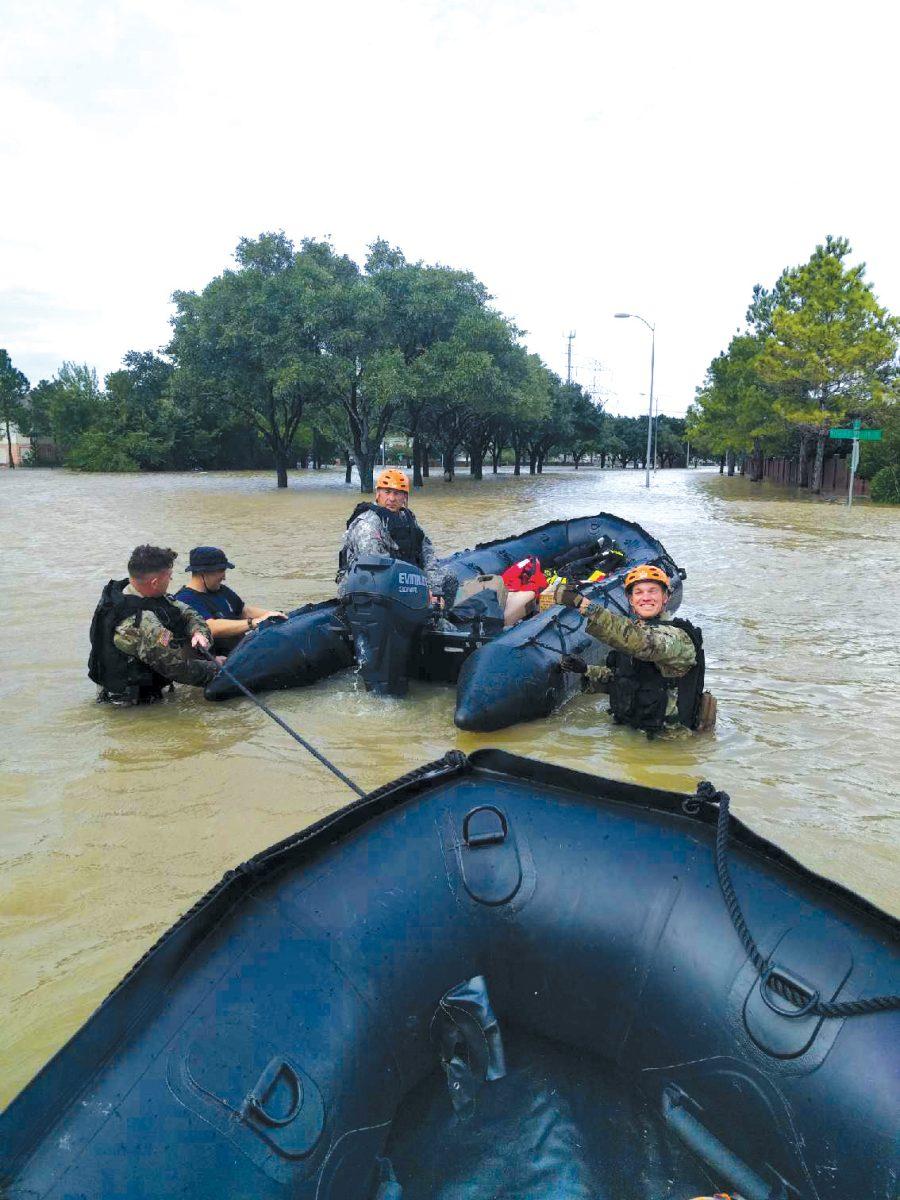 Members+of+the+National+Guard+used+rafts+to+transport+people+and+supplies+through+the+more+flooded+areas+of+Houston.
