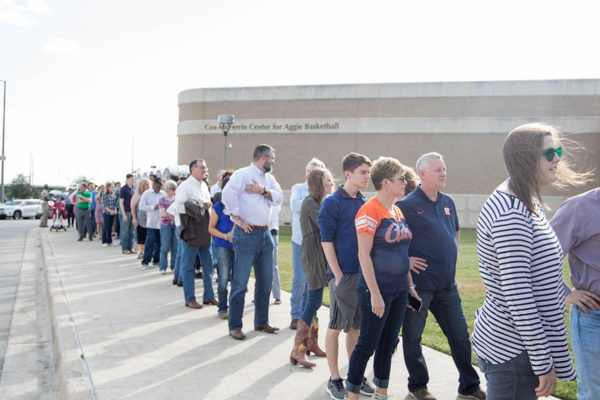 Concert-goers line up outside Reed Arena  before being admitted to the One America Appeal concert Saturday afternoon.