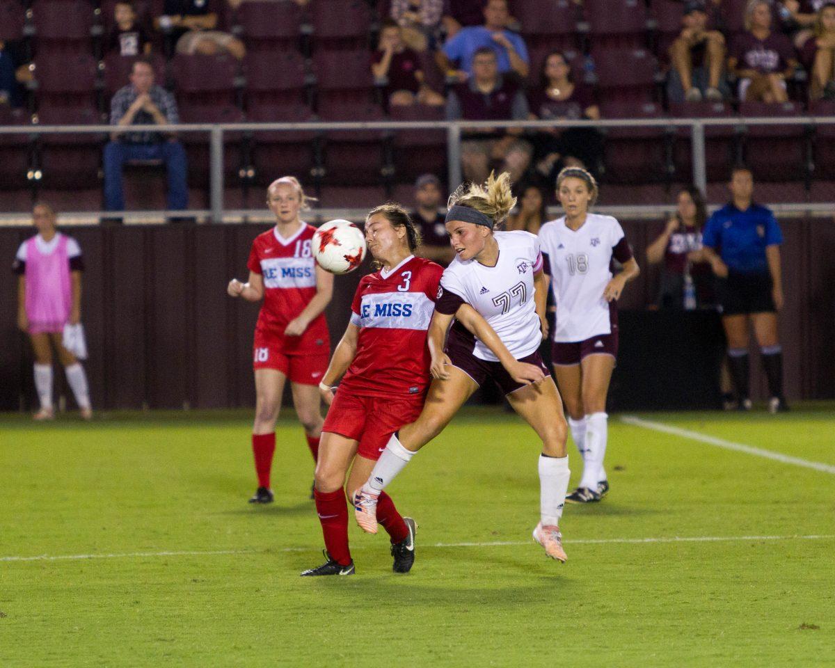 Senior midfielder Mikaela Harvey goes one-on-one against a Rebel soccer player.