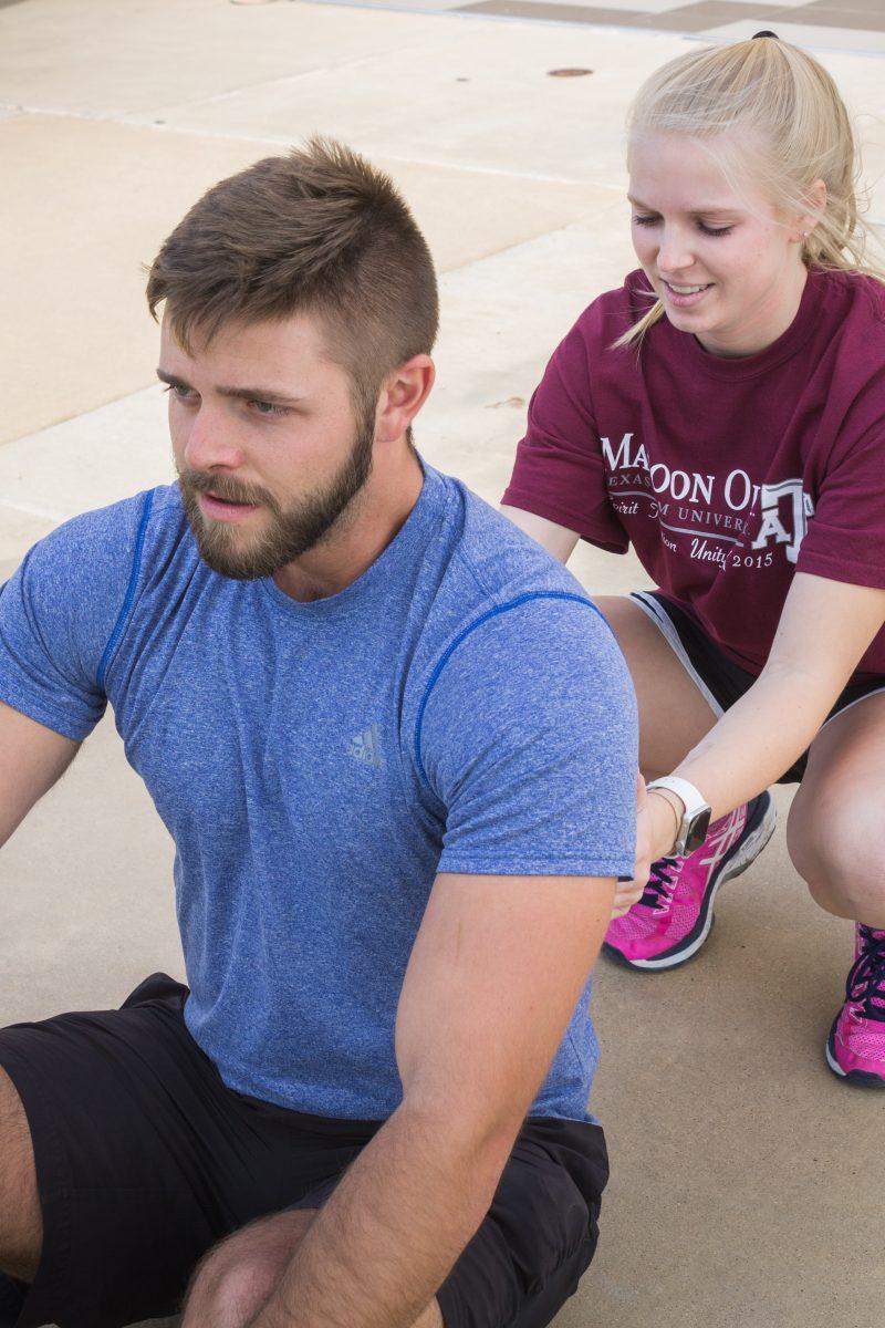 Recreation, parks and tourism sciences senior Larry Vire and junior Britta Haglund simulate what to do in the event of Hyponatremia also known as water intoxication. 