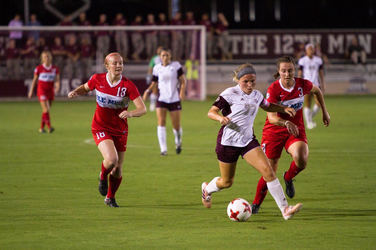 Senior midfielder Mikaela Harvey successfully dodges two Ole Miss defenders as she approaches the Ole Miss penalty area.