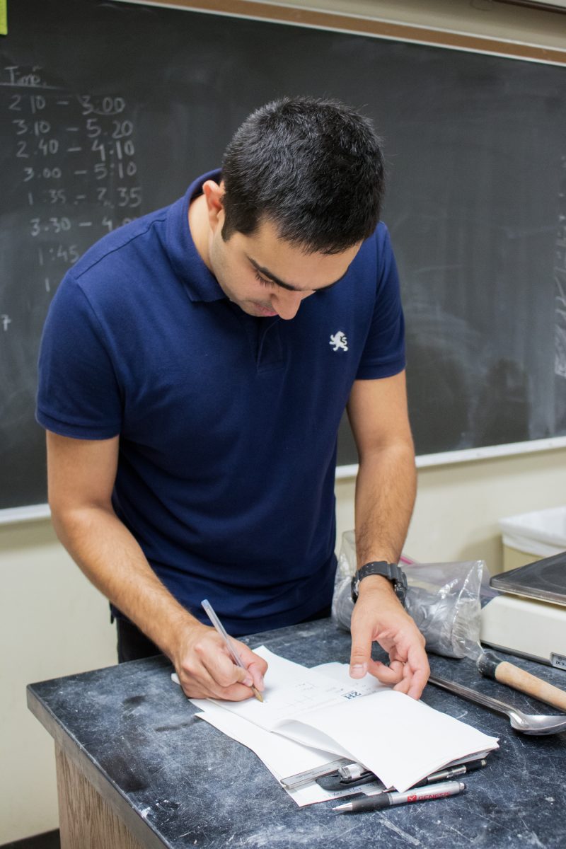 Iman Shafi, a Ph.D. candidate in the Civil Engineering Department, records the properties of the soil samples collected before conducting erosion tests.