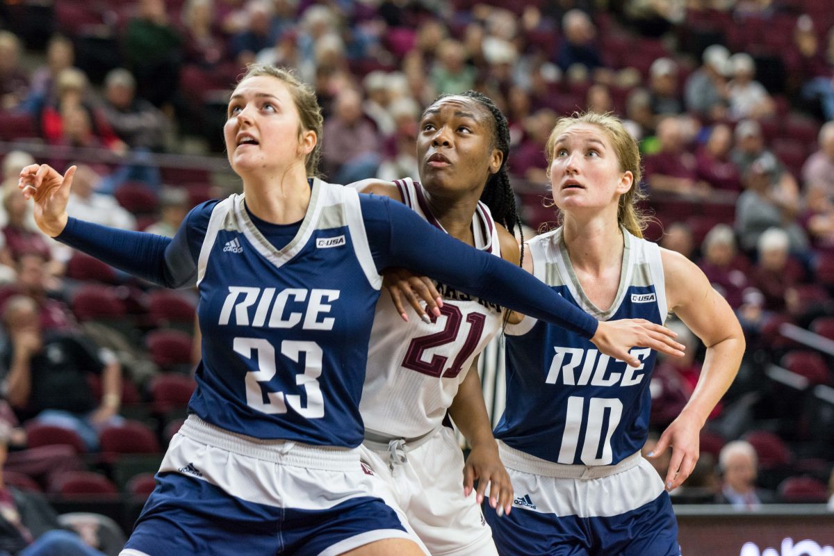 Rice forward Alexah Chrisman, Senior forward Jasmine Lumpkin and Rice guard Wendy Knight contend for a rebound in the second half.