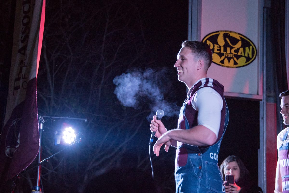 Head Yell Leader Ian Moss welcomes the crowd of Aggies to Midnight Yell Practice at Walk-Ons in Baton Rouge, LA.