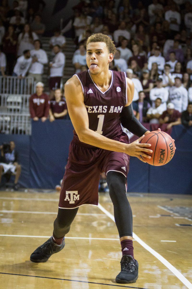 Junior forward DJ Hogg looks to pass the ball inside.