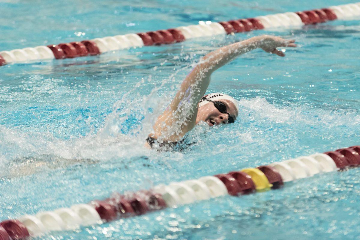 Junior Nata Gvakharia&#160;takes a breath while swimming the 500 yard freestyle