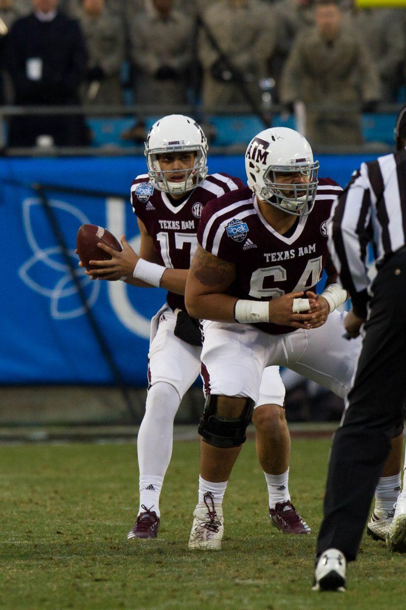 Redshirt freshman Nick Starkel takes a quick snap as the last minutes of the game start turning into seconds.