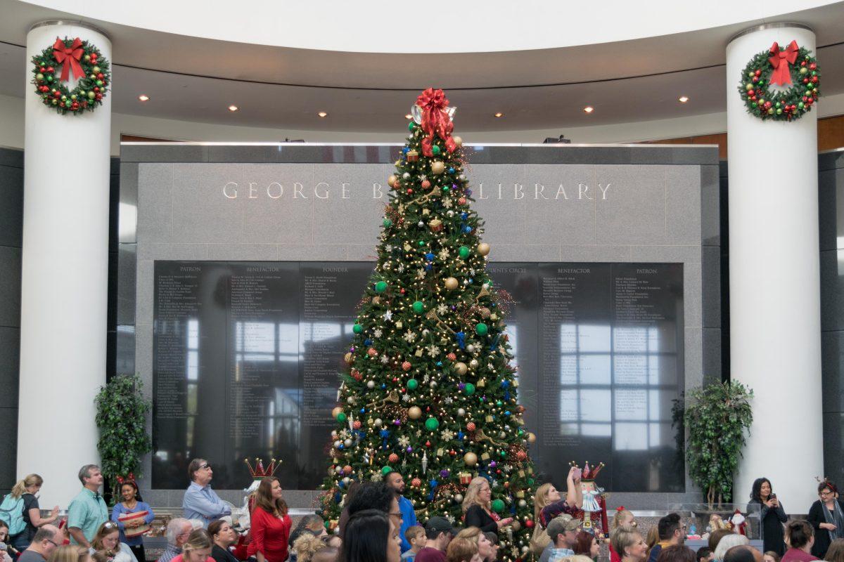 <p>Towering over the local singers and dancers performing in the Rotunda stood the 19 foot tall brightly decorated Christmas tree.</p>