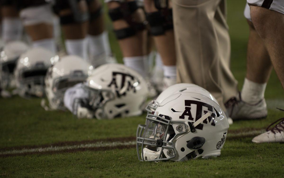 Aggie helmet on the grass of Kyle Field during Victory Yell. 