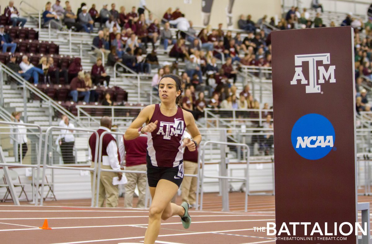 Junior Lizette Chapa rounds the final turn in the mile run.