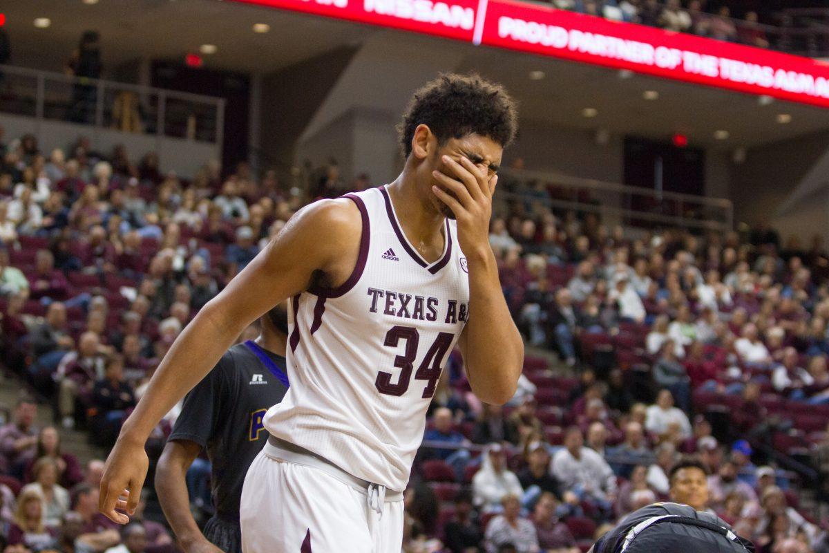 Junior center Tyler Davis winces in pain after being hit in the face.