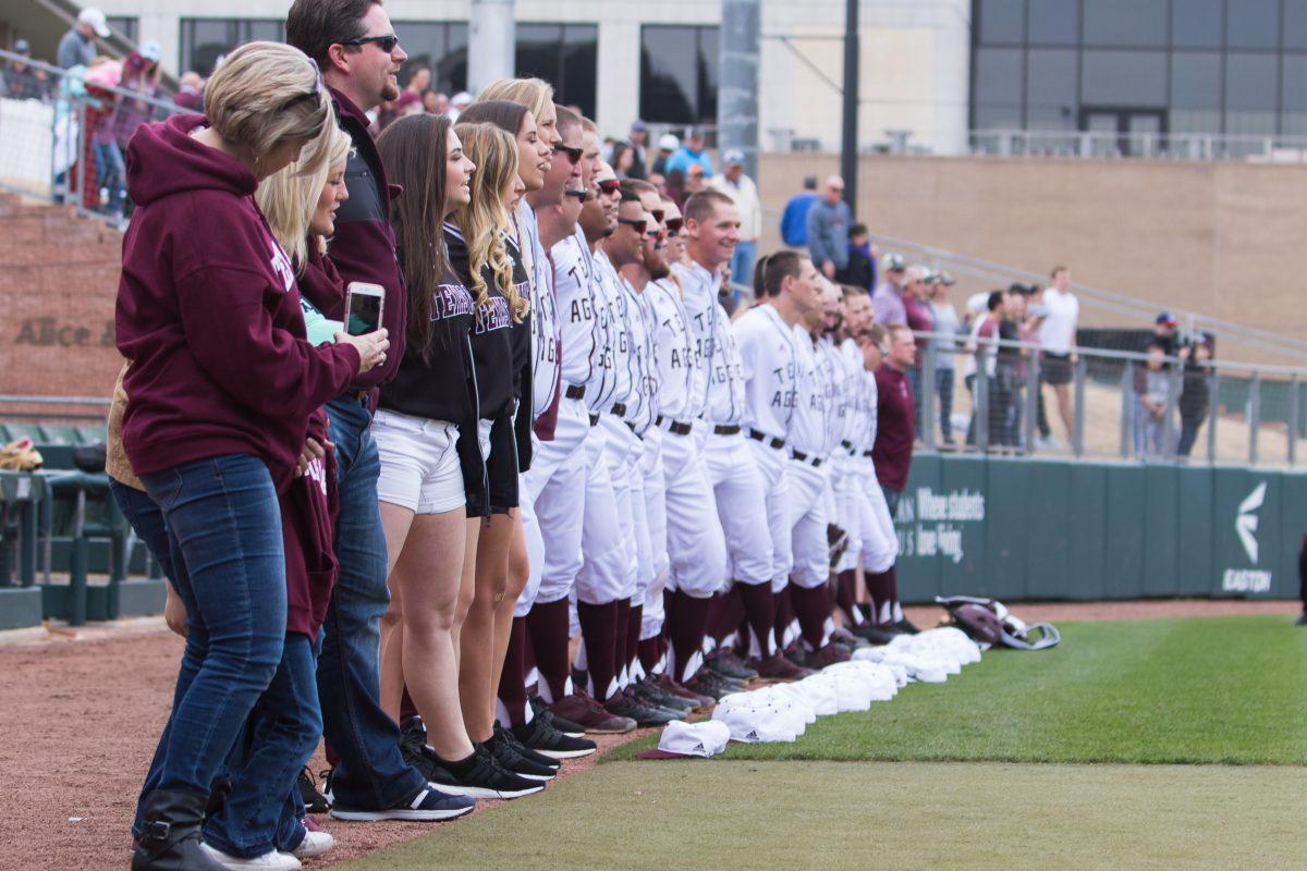 The Texas A&M baseball team lines up prior to the first inning to sing the Aggie War Hymn. 