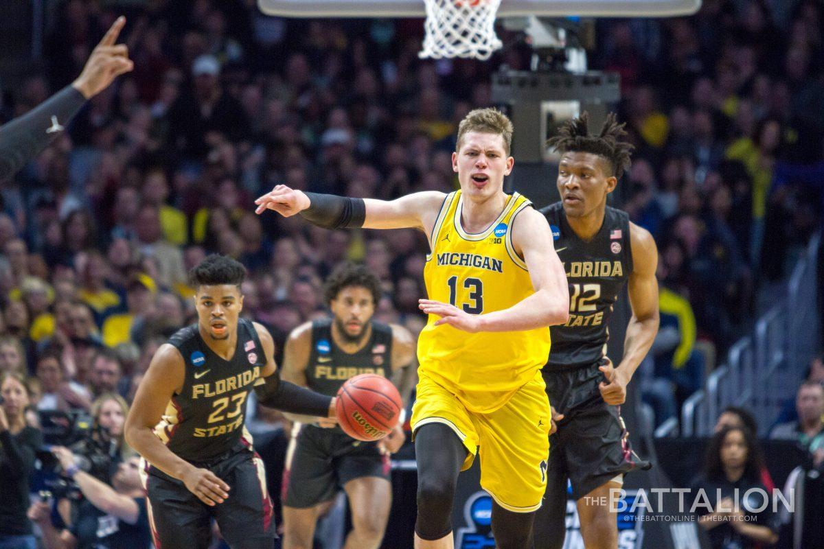 Michigan forward Moritz Wagner tries to set up defense as FSU transitions into offense.