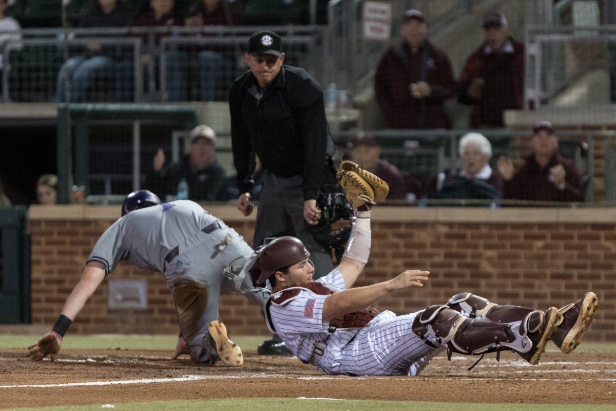 Junior catcher George Janca tags Northwestern State first baseman for the out at home plate to end the third inning.