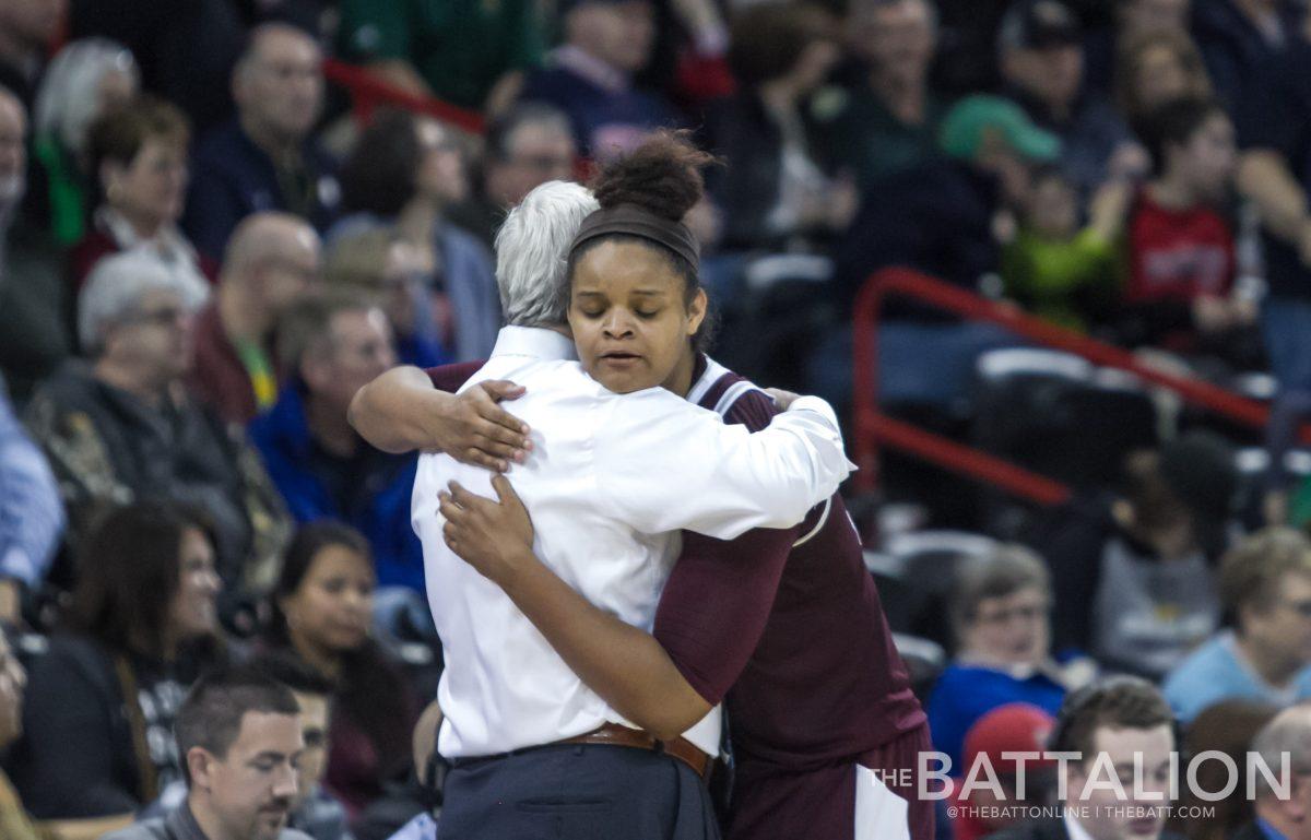 Senior Khaalia Hillsman&#160;embraces head coach Gary Blair after the last game of her four year career for Texas A&amp;M University.