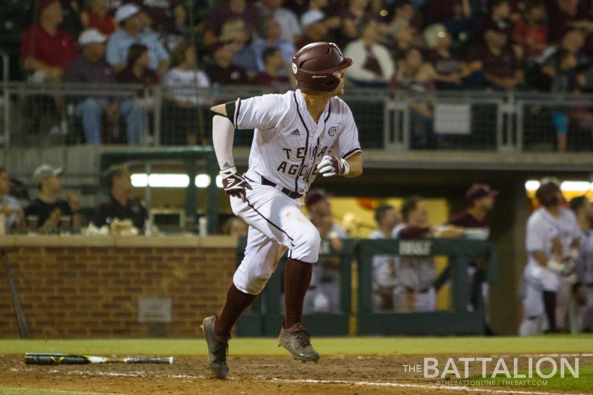 Freshman outfielder Zach DeLoach runs to first base.