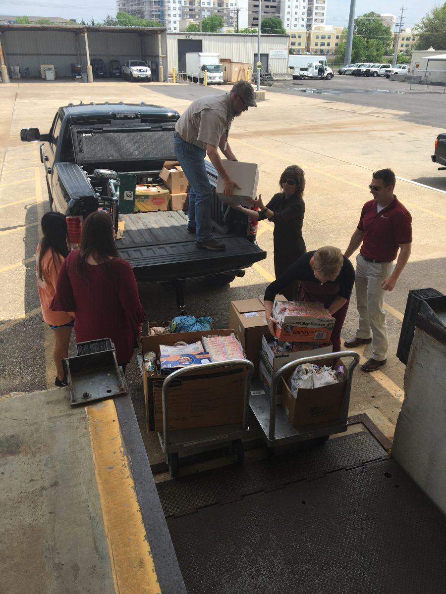 Transportation Services Department committee delivered hundreds of pounds of food to The 12th Can food pantry Monday afternoon.