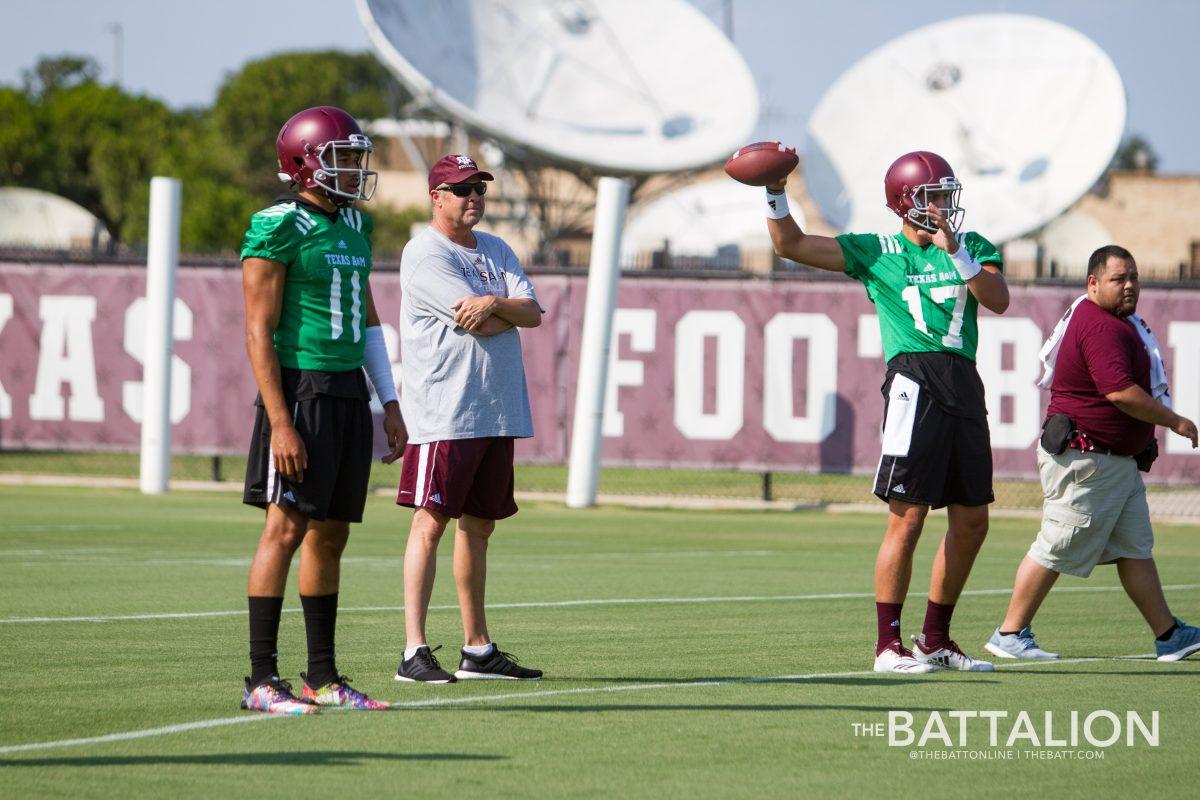 Sophomore quarterbacks Kellen Mond and Nick Starkel warm up their arms with the other quarterbacks during the first day of Fall Camp.
