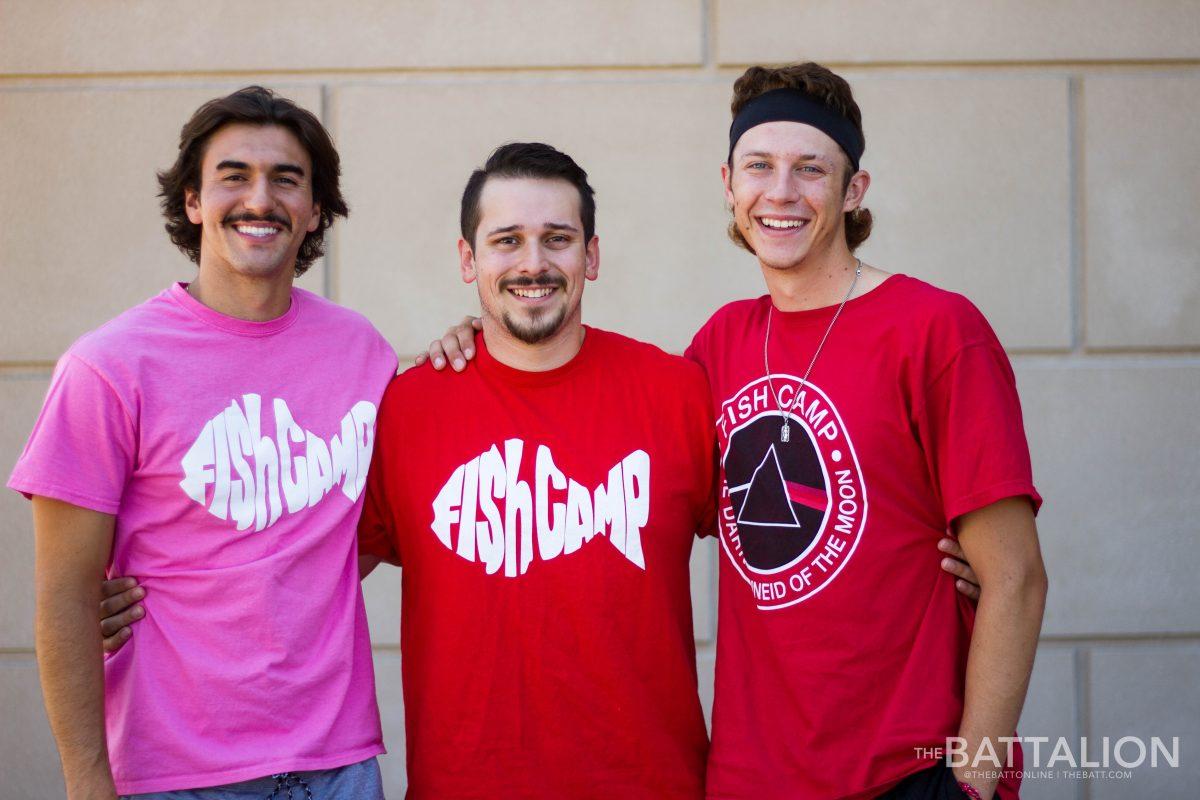 Nico Monroig (left), industrial distribution sophomore and Philip Grandjean (right), psychology junior were part of Fish Camp&#8217;s Camp Schnieder, which provided co-chair Travis Hyatt (middle), psychology senior with colorblind sight glasses.