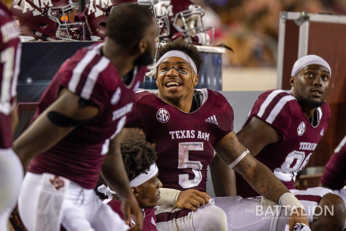 Junior running back Trayveon Williams laughs with teammates.