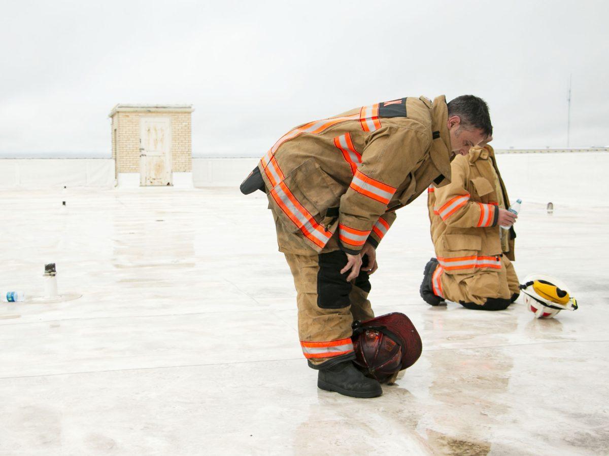 Bryan+Firefighter+Luke+Aneillo+catches+his+breath+on+the+rooftop+of+the+Varisco+Building+in+full+gear.