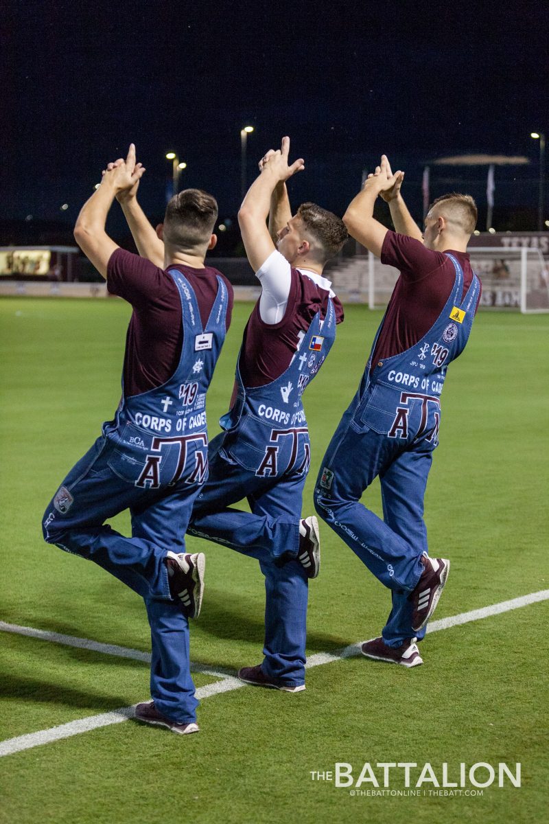 Senior Yell Leaders Connor Joseph, Gavin Suel, and Blake Jones whoop after the introductions of each Aggie soccer player.