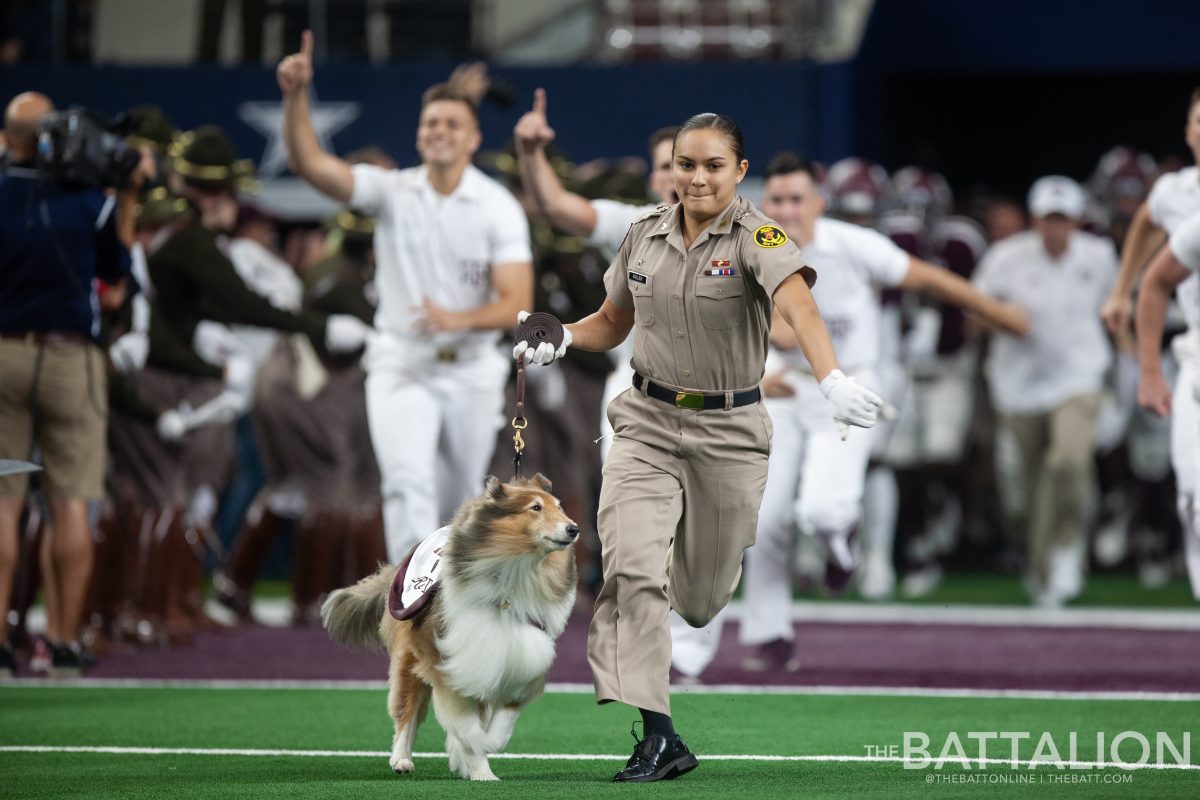 Sophomore&#160;Mia Miller runs out with Reveille IX before the Southwest Classic where Texas A&amp;M will take on University of Arkansas.