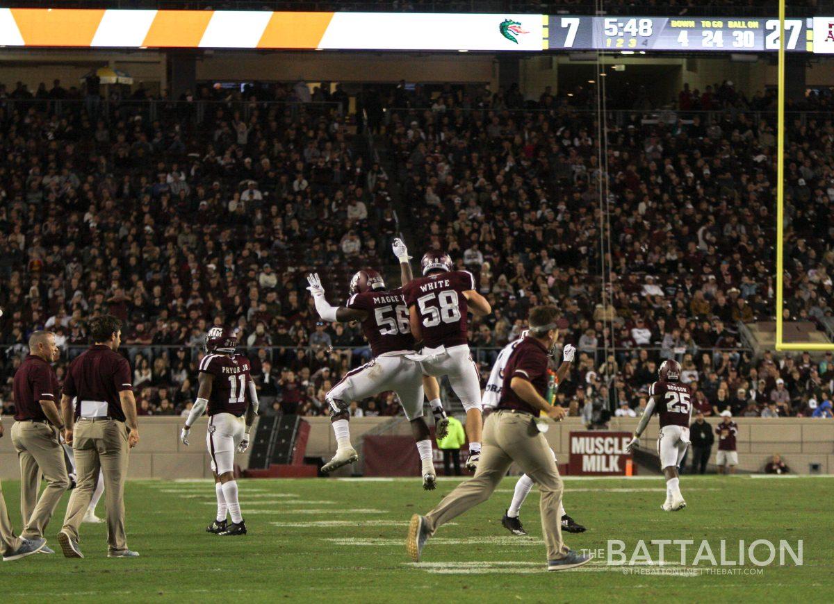 Keeath Magee II and Braden White celebrate midair after a big play. 