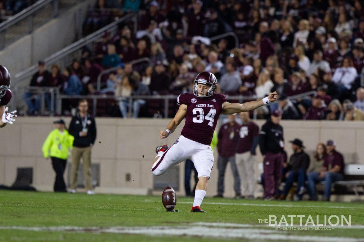 Junior Braden Mann kicks off for the Aggies.