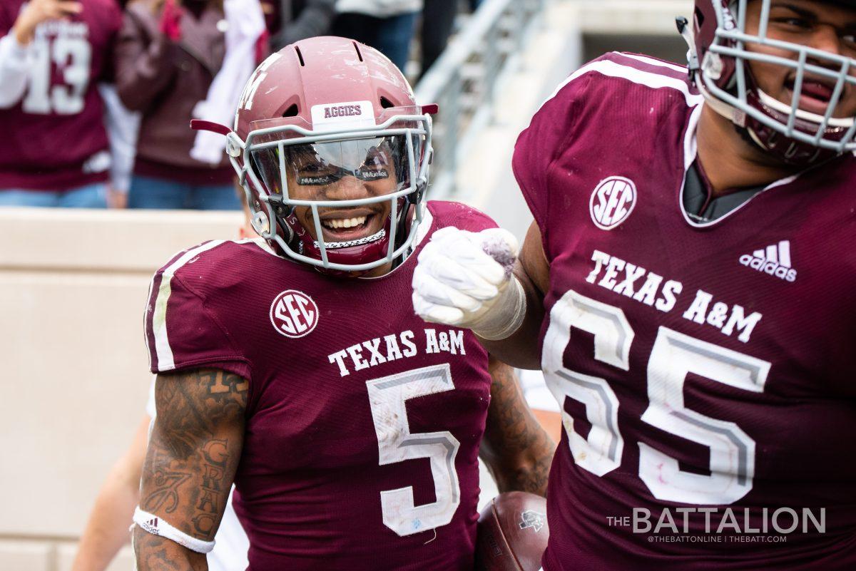 Junior running back Trayveon Williams celebrates after scoring a touchdown.