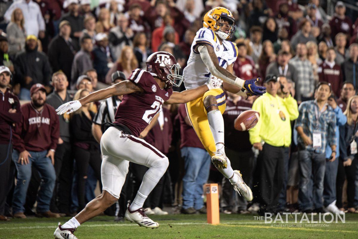 Junior defensive back Charles Oliver tries to get the ball from LSU junior wide receiver Dee Anderson.