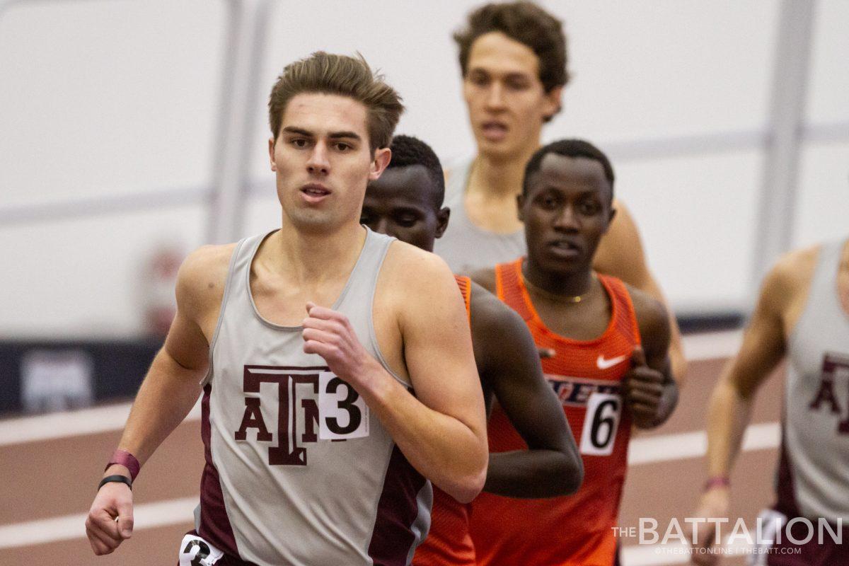 Senior Noah Jacobs leads the pack during the mens 3000 meter run. 