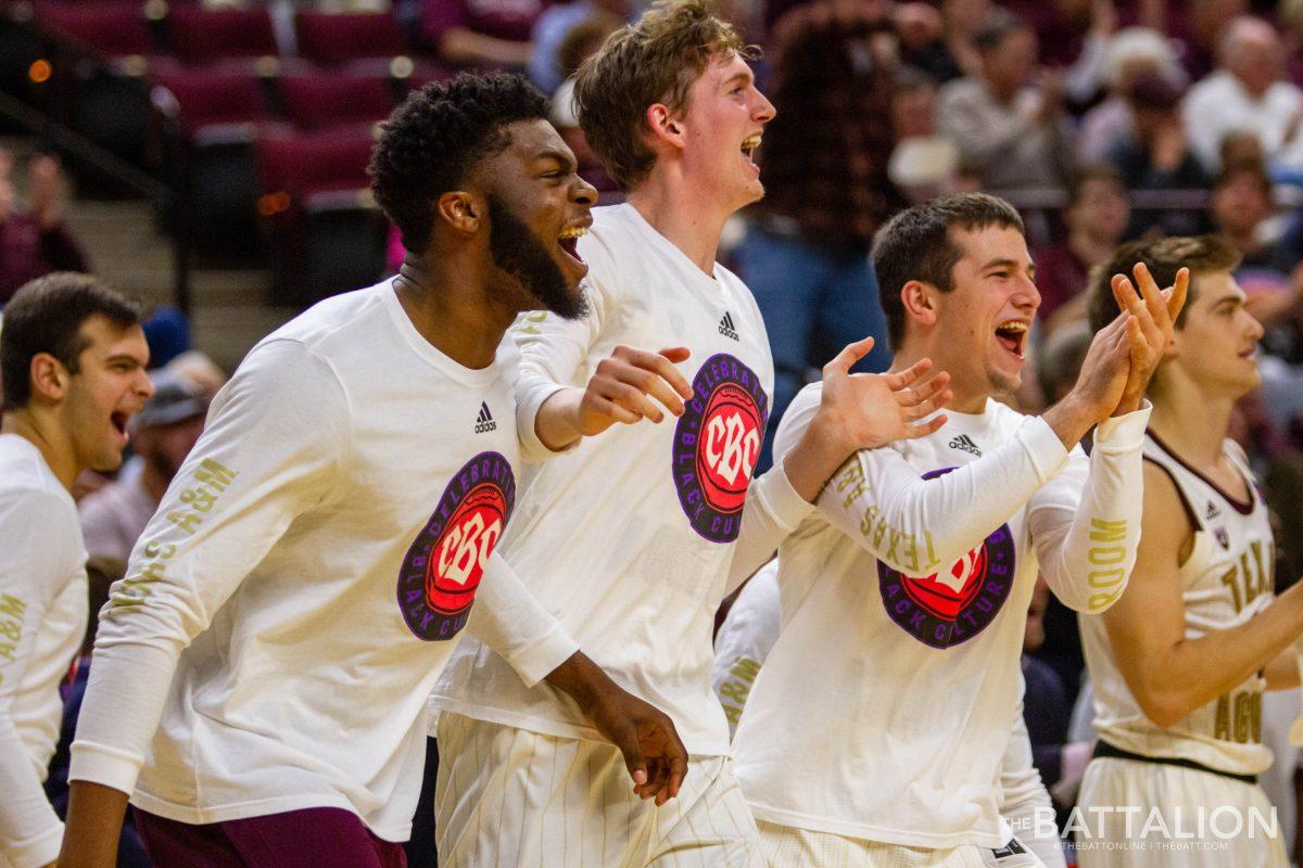 The+Aggie+bench%2C+including+junior+Josh+Nebo%2C+sophomore+John+Brown+and+freshman+Zach+Walker%2C+celebrate+after+two+Georgia+turnovers+result+in+dunks+for+both+freshman+John+Walker+III+and+sophomore+TJ+Starks.