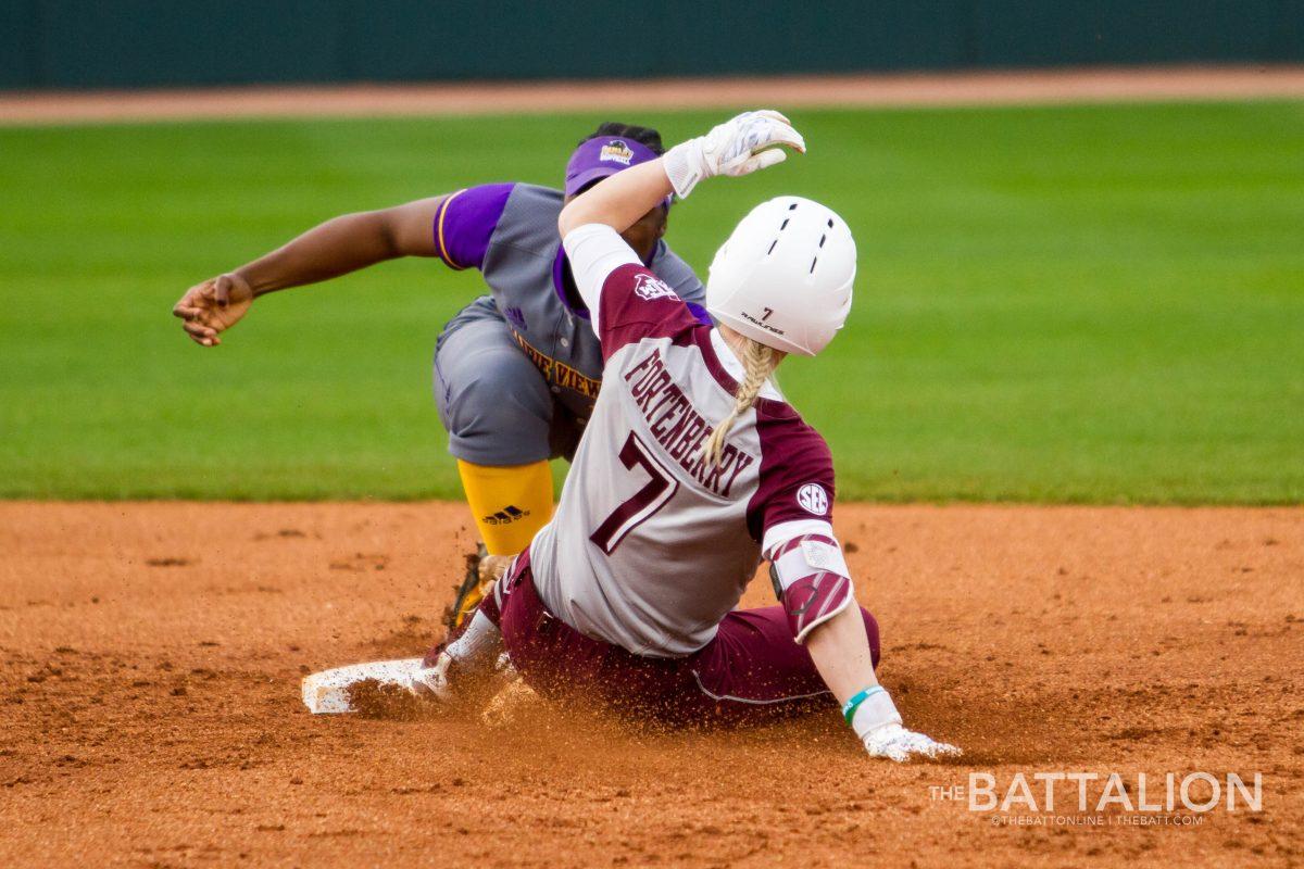 Junior outfielder Kelbi Fortenberry slides into second base with an unsuccessful tag by Prairie View second basemen Destinee Williams.